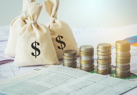 Money saving and money bag with coin stack growing business.の写真素材