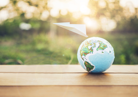 Travel the world monument concept,globe with paper plane.の写真素材
