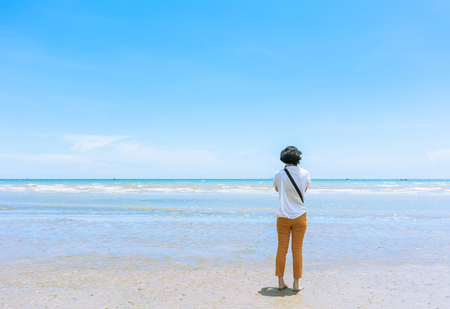 Woman relaxing on the tropical beach summer vacation,Pattaya,Thailand.の写真素材