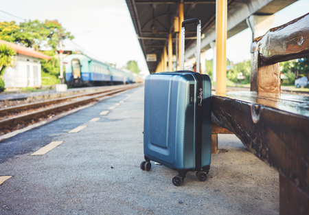 Traveling luggage at train station. Travel lifestyle concept.の写真素材