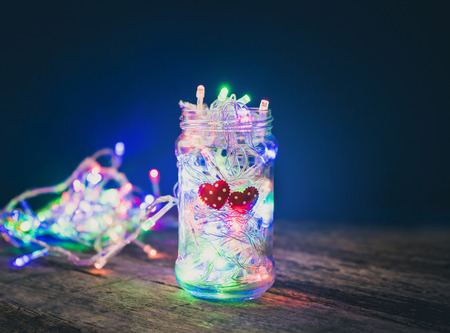 Valentines Day background with hearts and light in the bottle.の写真素材