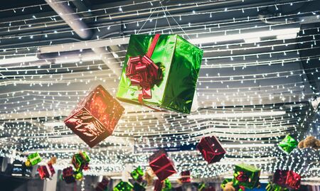 Christmas gift hanging with christmas light.の写真素材