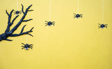 Halloween spiders with tree on yellow background,Halloween Background with copy space.の写真素材
