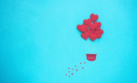 Love and Valentines Day background with balloon heart on blue background, copy space.の写真素材