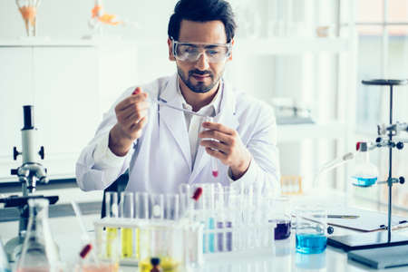 Scientist hand holding a Test tubes,Laboratory research.の写真素材