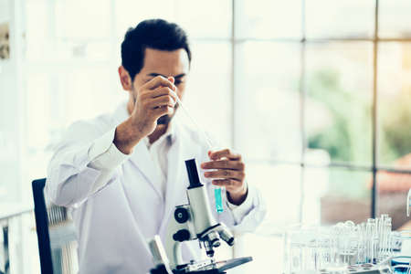 Scientist hand holding a Test tubes,Laboratory research.の写真素材