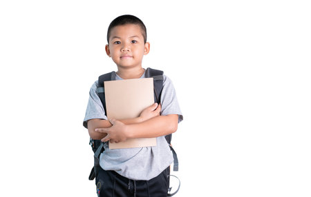 Back to school. The asian student smile for happy,smiling student boy with notebook and bag isolated on white balkground.の写真素材