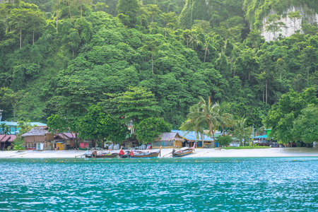 Phi Phi Don Island and Long Tail Boats in Krabi, Thailand. Wonderful beach at andaman sea.の写真素材