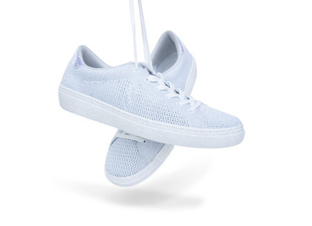 Pair of white female fashion sneakers isolated on white background with clipping path.Top view.の写真素材