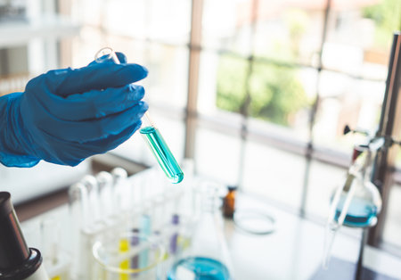 Test tubes with liquid in laboratory,Scientist working at the laboratory.の写真素材