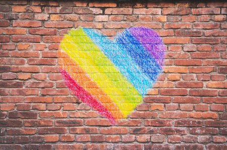 Painting heart in rainbow colors on Brick wall.の写真素材