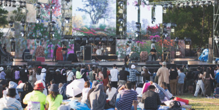 Blurred image people enjoying watching concert an outdoors music, community event, festival.の写真素材