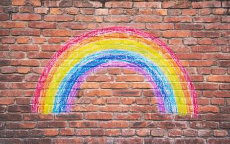 Painting rainbow colors on Brick wall.