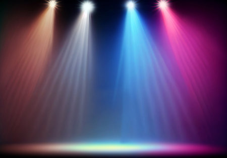 Stage lights.Colorful spotlight strike through the darkness.smoke volume light effect on black background.の素材