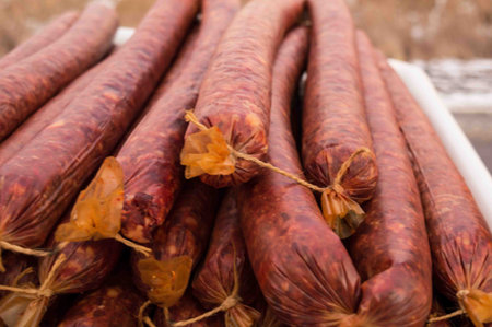 Several pairs of sausages. Spices. Spicy food.