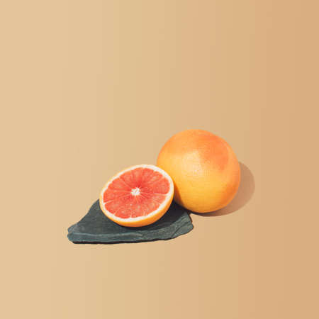 Minimal sunlit fruit composition and sand color background. Creative copy space.の写真素材
