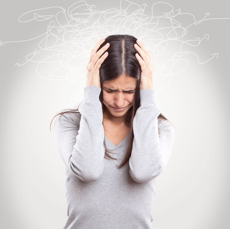 Young woman suffering headache