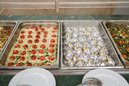 photo of a variety of food on the buffet at the hotelの写真素材