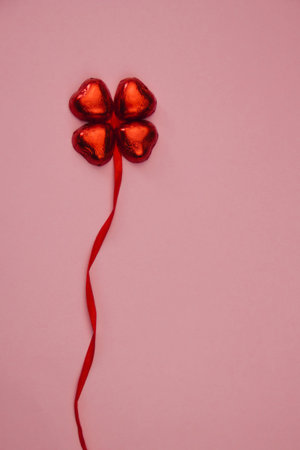 St Valentines romantic love concept - Four red chocolate hearts forming clover leafの写真素材
