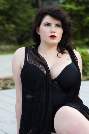 Young beautiful busty curvy  plus size model with big breast in black bra and lace cape, xxl woman,...