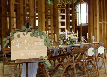 Plate Welcome to our wedding in the foreground. Wedding party. Vintage Style.の写真素材