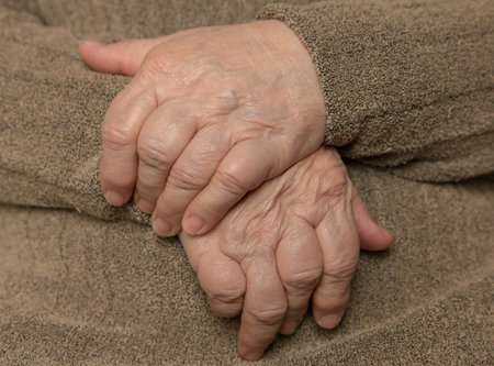 Hands of an elderly woman. Wrinkles. Close-up.の写真素材