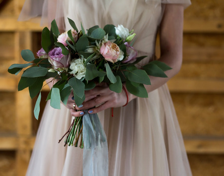 The bride holds a wedding bouquet. The bride's bouquet. Close-up.の写真素材
