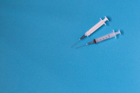syringes for injection on a blue backgroundの写真素材