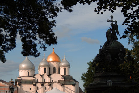 ancient Russian Cathedral of St. Sophia in Novgorod, Russia, with white plastered walls and several...