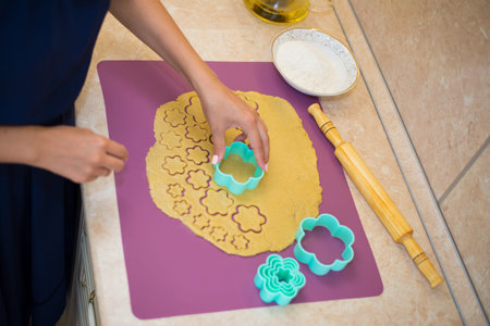 Homemade bakery making, gingerbread cookies in form of Christmas tree close-up. New year treat for...