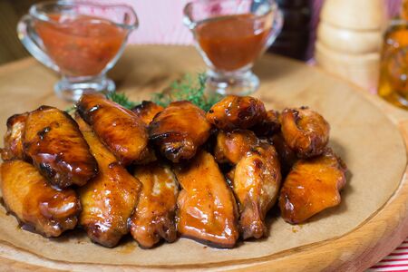 Grilled chicken wings on a tree dillの写真素材