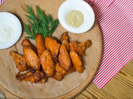 Grilled chicken wings on a tree dillの写真素材