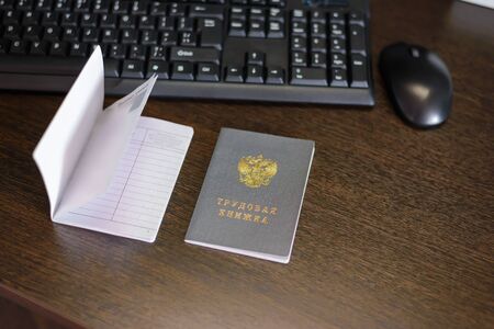Russian document. Workbooks. Two employment records, a document for recording work experience. Inscription "WORK BOOK" in Russian.の写真素材