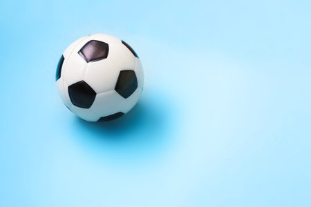 Miniature of a football and basketball on a blue background. Physical development of the child....