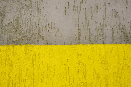 Old grunge texture, gray concrete wall. Colors yellow and gray, Color of the year of 2021. Illuminating, Ultimate Gray.の写真素材