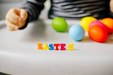 Hand Kid Boy Letters Easter Background Colored Eggs. Postcard. Family Learning to Read. Selective...