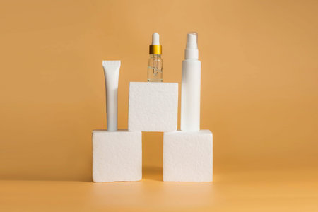 Unbranded bottle with dispenser on geometric podium stands. Unbranded bottles in mockup style....
