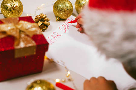 Child writing letter to Santa at home. Selective focus. Holidays, traditions conceptの写真素材