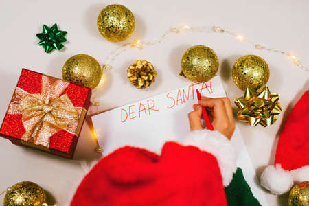 Child writing letter to Santa at home. Selective focus. Holidays, traditions conceptの写真素材