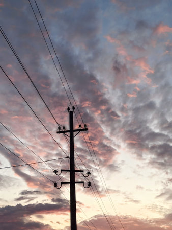 power lines in the sunsetの写真素材