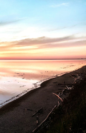 Sunset on the beach of the Baltic Sea in Poland. Landscape.