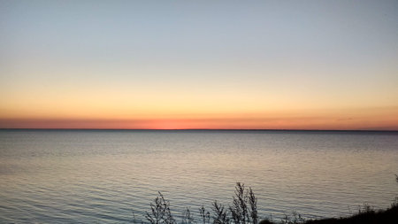 Beautiful sunset over the sea. Beautiful summer landscape. Sunset on the lake.の写真素材