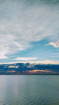 beautiful sunset over the sea with clouds in the sky, nature seriesの写真素材