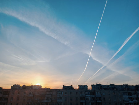 Sunset over the roofs of the city. View from above.の写真素材