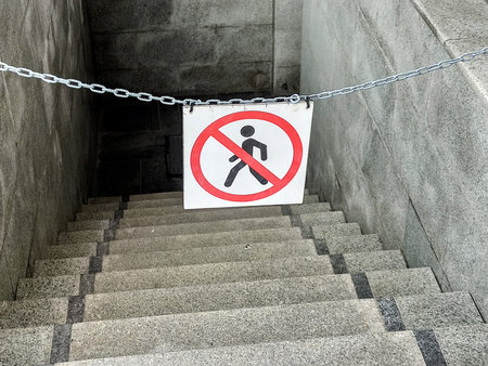 No walking sign on the concrete stairs in the city. No walkingの写真素材