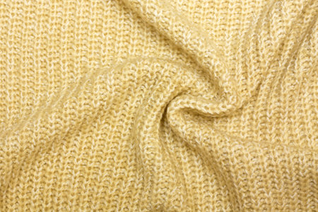 knitted background beige closeup