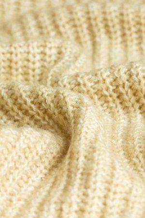 knitted background beige closeup