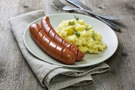 sausages and mashed potatoes on a plateの写真素材