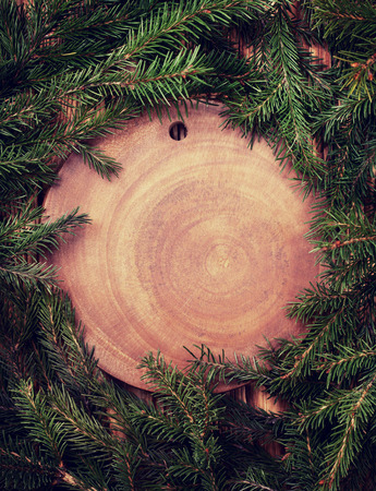 Christmas tree on a wooden background, top view, with space for text (Toning)の写真素材