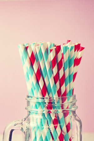 Paper Straws cocktail in a glass Mason jar in vintage styleの写真素材